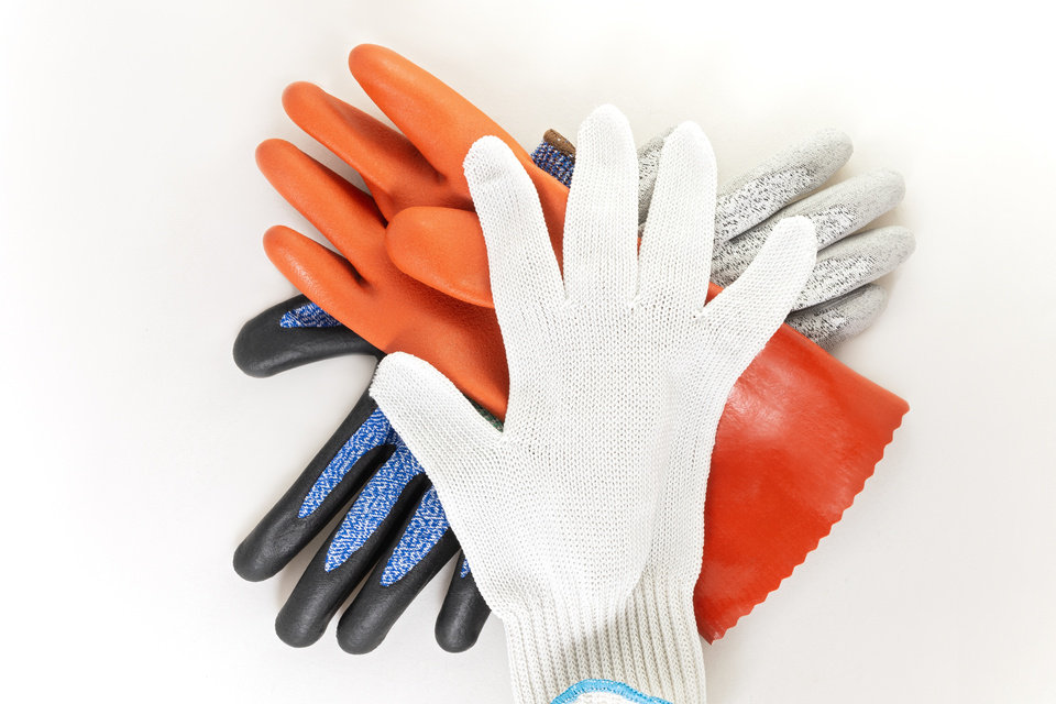 safety gloves in stack against white